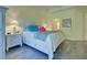 Main bedroom with a king-size bed and en-suite bathroom at 1152 Beachcomber Ct # 15, Osprey, FL 34229