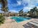 Inviting community pool with lounge chairs and gazebo at 1152 Beachcomber Ct # 15, Osprey, FL 34229