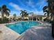 Community pool area with plenty of lounge chairs at 1152 Beachcomber Ct # 15, Osprey, FL 34229