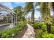 Backyard path leading from the enclosed pool to a private boat dock at 121 Holly Ave, Sarasota, FL 34243