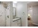 Bathroom view of the shower with marble tile walls and fixtures, along with a granite countertop at 121 Holly Ave, Sarasota, FL 34243