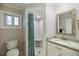 Bathroom showcasing a walk-in shower, white vanity, and tiled floor at 121 Holly Ave, Sarasota, FL 34243