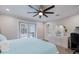 Bedroom with fan, patio access, and a dresser at 121 Holly Ave, Sarasota, FL 34243