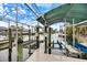 Covered boat dock featuring lifts, providing convenient waterfront access at 121 Holly Ave, Sarasota, FL 34243