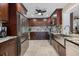 Modern kitchen with stainless steel appliances and dark wooden cabinets at 121 Holly Ave, Sarasota, FL 34243