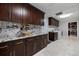 Extended counterspace in the laundry room featuring sleek dark cabinets and marble countertops at 121 Holly Ave, Sarasota, FL 34243