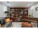 Well-decorated living room with a grand bookshelf and a piano at 121 Holly Ave, Sarasota, FL 34243