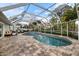 Screened-in pool with brick paver patio and in-ground spa at 121 Holly Ave, Sarasota, FL 34243