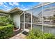 Exterior view of the home with a screened-in pool and outdoor kitchen at 121 Holly Ave, Sarasota, FL 34243