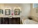 Double vanity bathroom with soaking tub at 12471 Natureview Cir, Bradenton, FL 34212