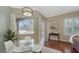 Bright breakfast nook with glass table and view of the pool at 12471 Natureview Cir, Bradenton, FL 34212