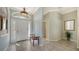 Bright and airy entryway with tile flooring and bench at 12471 Natureview Cir, Bradenton, FL 34212