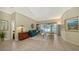 Bright living room with a view of the pool and neutral decor at 12471 Natureview Cir, Bradenton, FL 34212