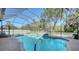 Inviting screened pool area with a fountain and comfortable lounge chairs at 12471 Natureview Cir, Bradenton, FL 34212