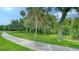 Curving concrete path through lush green landscape at 12471 Natureview Cir, Bradenton, FL 34212