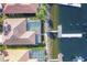 Bird's eye view of a waterfront home with a pool and private dock at 129 12Th E Ave, Palmetto, FL 34221