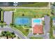 Aerial view of community tennis court and pool at 129 12Th E Ave, Palmetto, FL 34221