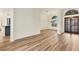 Open living room with wood-look floors at 129 12Th E Ave, Palmetto, FL 34221