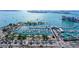 Expansive aerial view of a marina showcasing numerous boats and yachts with waterfront condo buildings in the background at 1350 Main St # 1410, Sarasota, FL 34236