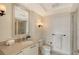 Bathroom featuring marble countertop, mirror, sink, toilet and shower at 1350 Main St # 1410, Sarasota, FL 34236