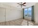 Bedroom with water views, wood floors and ceiling fan at 1350 Main St # 1410, Sarasota, FL 34236