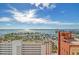 Expansive city view showcasing boats and buildings in a vibrant coastal setting under a blue sky with clouds at 1350 Main St # 1410, Sarasota, FL 34236