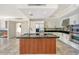 Modern kitchen island with black countertops, and stainless appliances at 1350 Main St # 1410, Sarasota, FL 34236