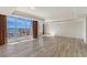 Bright living room with hardwood floors, floor-to-ceiling windows, and stunning water views at 1350 Main St # 1410, Sarasota, FL 34236