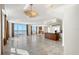 Spacious living area boasts tile flooring, floor-to-ceiling windows with a water view, and an open layout to the kitchen at 1350 Main St # 1410, Sarasota, FL 34236