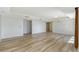 Large living room with multiple entryways and hardwood flooring throughout at 1350 Main St # 1410, Sarasota, FL 34236