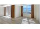 Bright living room features hardwood floors, multiple windows, and stunning water views at 1350 Main St # 1410, Sarasota, FL 34236