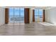 Bright living room features hardwood floors, multiple windows, and stunning water views at 1350 Main St # 1410, Sarasota, FL 34236