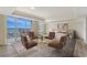 Stylishly furnished bedroom featuring a sitting area and stunning water views at 1350 Main St # 1410, Sarasota, FL 34236