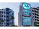 Marina Jack sign with high rise condo view and palm trees at 1350 Main St # 1410, Sarasota, FL 34236