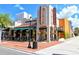 Inviting exterior view of the theater, featuring classic signage and cozy seating surrounded by floral accents at 1350 Main St # 1410, Sarasota, FL 34236