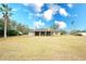 Home exterior showcasing screened patio and yard at 13609 2Nd Ne Ave, Bradenton, FL 34212