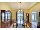 Elegant dining room with hardwood floors, a large table, and hutch at 13609 2Nd Ne Ave, Bradenton, FL 34212