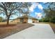 Exterior view of the house, showing the garage and driveway at 13609 2Nd Ne Ave, Bradenton, FL 34212