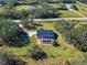 Aerial view showing home, pool, and expansive property at 13995 Mossy Hammock Ln, Myakka City, FL 34251