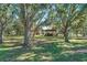 Spacious backyard with a covered area at 13995 Mossy Hammock Ln, Myakka City, FL 34251