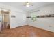 Bedroom with tile floors, ceiling fan and double door closet at 13995 Mossy Hammock Ln, Myakka City, FL 34251