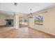 Bright dining room with tile floors, fireplace, and view of the pool at 13995 Mossy Hammock Ln, Myakka City, FL 34251