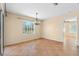 Tiled dining area with chandelier and window view at 13995 Mossy Hammock Ln, Myakka City, FL 34251