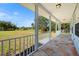 Front porch view of a large grassy backyard at 13995 Mossy Hammock Ln, Myakka City, FL 34251