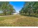 Charming house exterior with long driveway at 13995 Mossy Hammock Ln, Myakka City, FL 34251