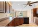 Island kitchen with granite countertops and sink at 13995 Mossy Hammock Ln, Myakka City, FL 34251