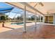 Relaxing pool and patio area with screened enclosure at 13995 Mossy Hammock Ln, Myakka City, FL 34251