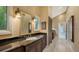 Elegant bathroom with dark wood vanity and granite countertop at 1423 Kimlira Ln, Sarasota, FL 34231