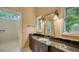 Bathroom features granite vanity and walk-in shower at 1423 Kimlira Ln, Sarasota, FL 34231