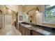 Bathroom boasts granite countertops and dark wood cabinets at 1423 Kimlira Ln, Sarasota, FL 34231